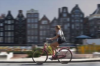 Blurred view of bicyclist on Amsterdam street