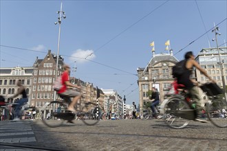 Blurred view of bicyclists on Amsterdam street