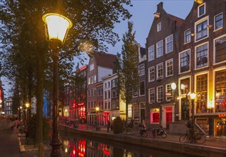 Illuminated streetlights on Amsterdam canal street