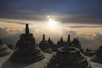 Spires on Temple of Borobudur at sunset