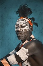 Black man wearing traditional body paint