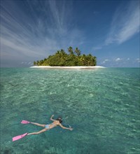 Caucasian woman snorkeling off tropical island
