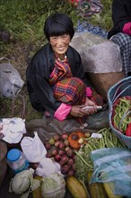Asian woman smiling at market