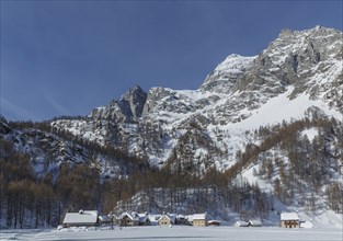 Rural village under snowy mountains