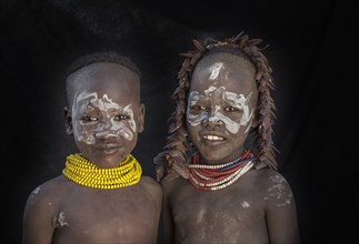 Black children with traditional face paint