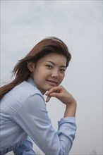 Chinese businesswoman smiling outdoors
