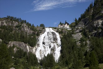 Building over waterfall on remote hillside