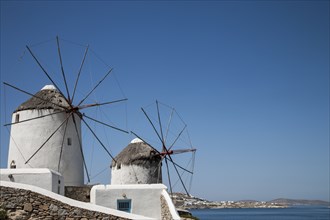 Traditional windmills under blue sky