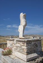 Statue ruins on stone pedestal