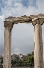 Ruin pillars and cloudy sky