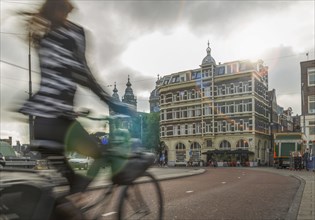 Blurred bicyclist on city street