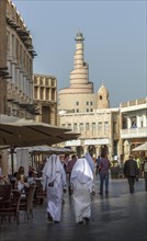 Men walking on Doha street
