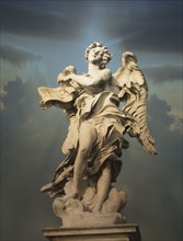 Low angle view of statue under cloudy sky