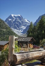 Log cabin under remote mountains
