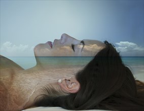 Double exposure of Caucasian woman sunbathing at beach