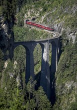 Train on mountain bridge