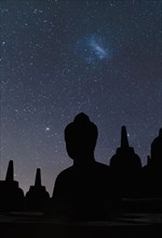 Silhouette of statue of Buddha at night