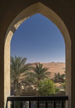 Scenic view of desert through arch