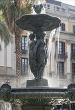 Water flowing on fountain in city