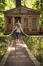 Couple on walkway of remote tree house