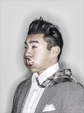 Businessman making face in wind