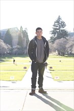 Mixed race college student smiling on campus