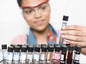 Mixed race student examining samples in lab