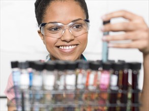 Mixed race student examining samples in lab