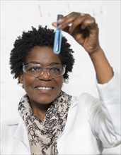 Black scientist examining sample in lab
