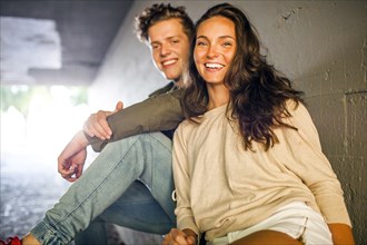 Caucasian couple smiling in tunnel