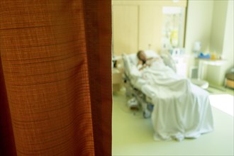 Defocused view of Caucasian woman laying in hospital bed