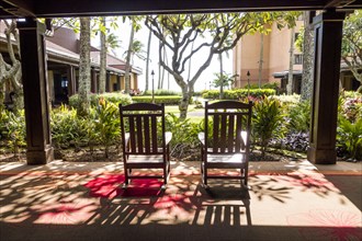 Empty rocking chairs on hotel porch