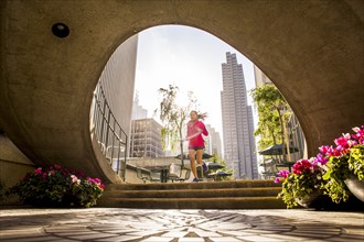 Woman running in urban park