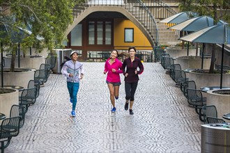 High angle view of women running in urban park