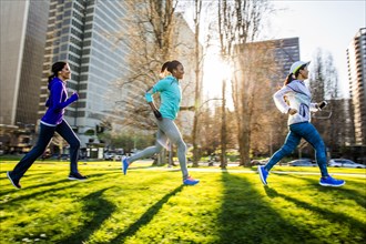 Women running in urban park
