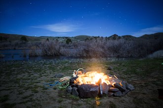 Burning campfire in remote field