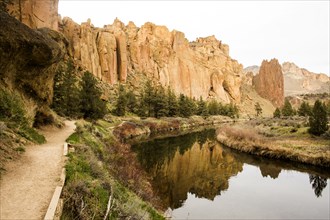 Desert cliffs reflecting in still river