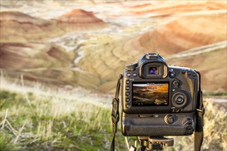 Camera photographing desert landscape