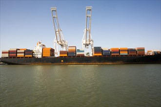 Cranes and shipping containers on barge