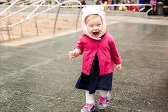 Caucasian girl laughing at park