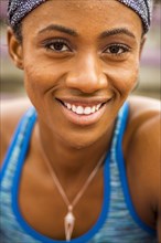 Smiling Black woman sweating