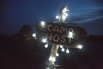 String lights on camp sign