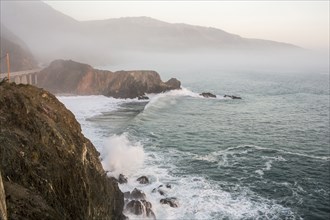 Waves splashing on rocks at cliffs