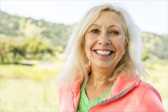 Portrait of smiling Older Caucasian woman outdoors