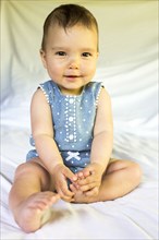 Portrait of smiling mixed race baby girl