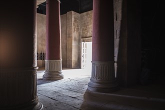 Open door and pillars in ancient building