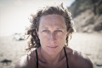 Serious Caucasian woman on beach