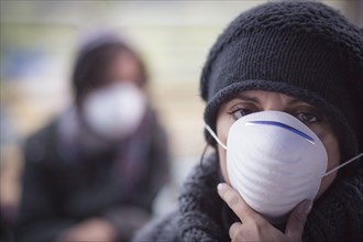 Caucasian woman wearing protective breathing mask