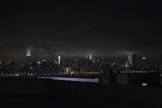 Illuminated New York City skyline at night