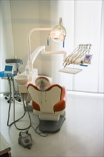 Empty chair in office of dentist